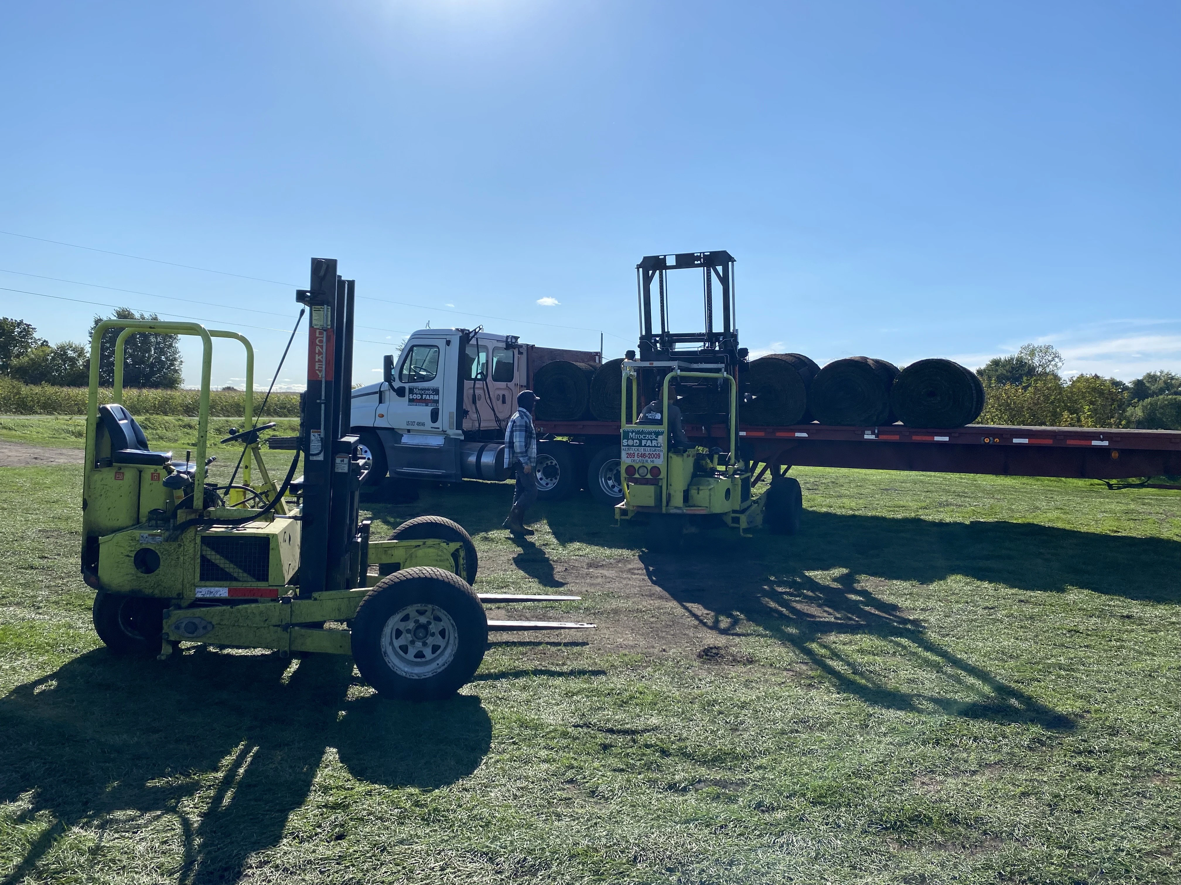 Sod delivery truck bringing fresh sod to residential property